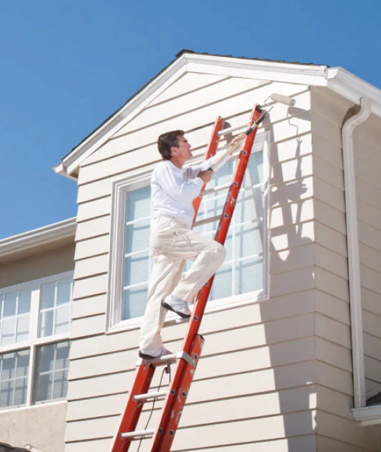 worker doing exterior painting service